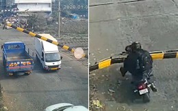Thanh niên ngã lộn nhào vì tông vào barie chắn tàu hỏa