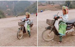 Cô gái dùng chân làm phanh khi tập đi xe máy
