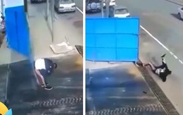 Chàng trai bị cửa cổng đập vào mông ngã lăn ra đường