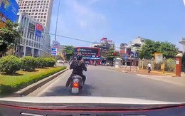 Tài xế hú hồn với nữ Ninja núp bóng cây tránh nắng chờ đèn đỏ