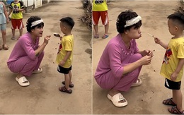 Bé trai đứng hình khi cô xin ăn một miếng hết cây kem