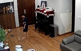 Bé trai đá bóng trong nhà làm vỡ bình rượu thuốc