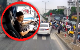 Tài xế xe đầu kéo chắn đường giúp học sinh qua quốc lộ an toàn