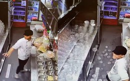 Thanh niên bất lực nhìn chồng hộp nhựa rơi hết xuống đất