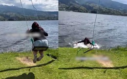 Cô gái đu xích đu bay xuống hồ nước