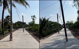 Con đường bê tông có trụ điện dựng kiểu trò chơi Flappy Bird