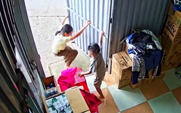 Hai chị em hối hả gom quần áo giúp bố mẹ khi trời mưa dông