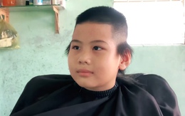 Bé trai cười không nổi với kiểu tóc mới