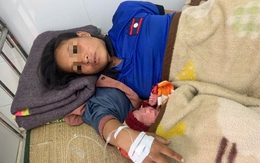 Sản phụ người Lào được cán bộ trạm y tế đỡ đẻ ngay bên đường