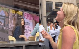 Cô gái bê tô cơm ra giữa đường xem Anne Hathaway đóng phim