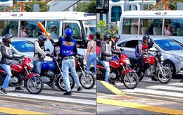 Bị gõ đầu vì dừng xe máy trên vạch kẻ đường dành cho người đi bộ