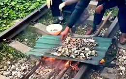Xử phạt cặp vợ chồng nướng đồ ăn trên đường ray, con gái quay clip đăng TikTok